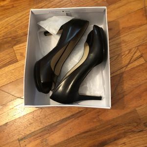 Nine West black leather pumps